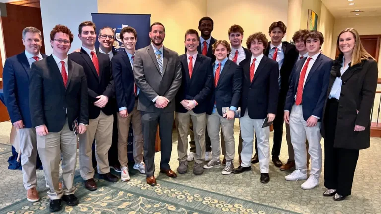 Group of kids and a medal recipient